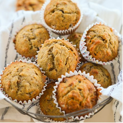 Freshly baked muffins in rustic basket